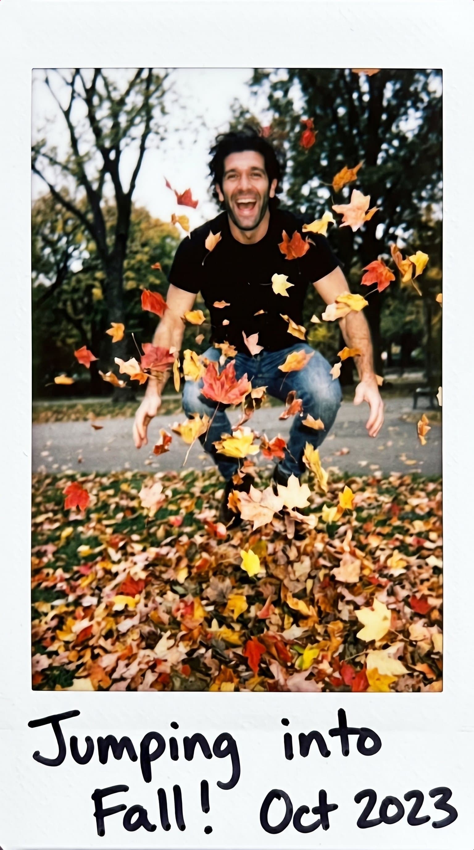 man jumping through colorful autumn leaves, Candid