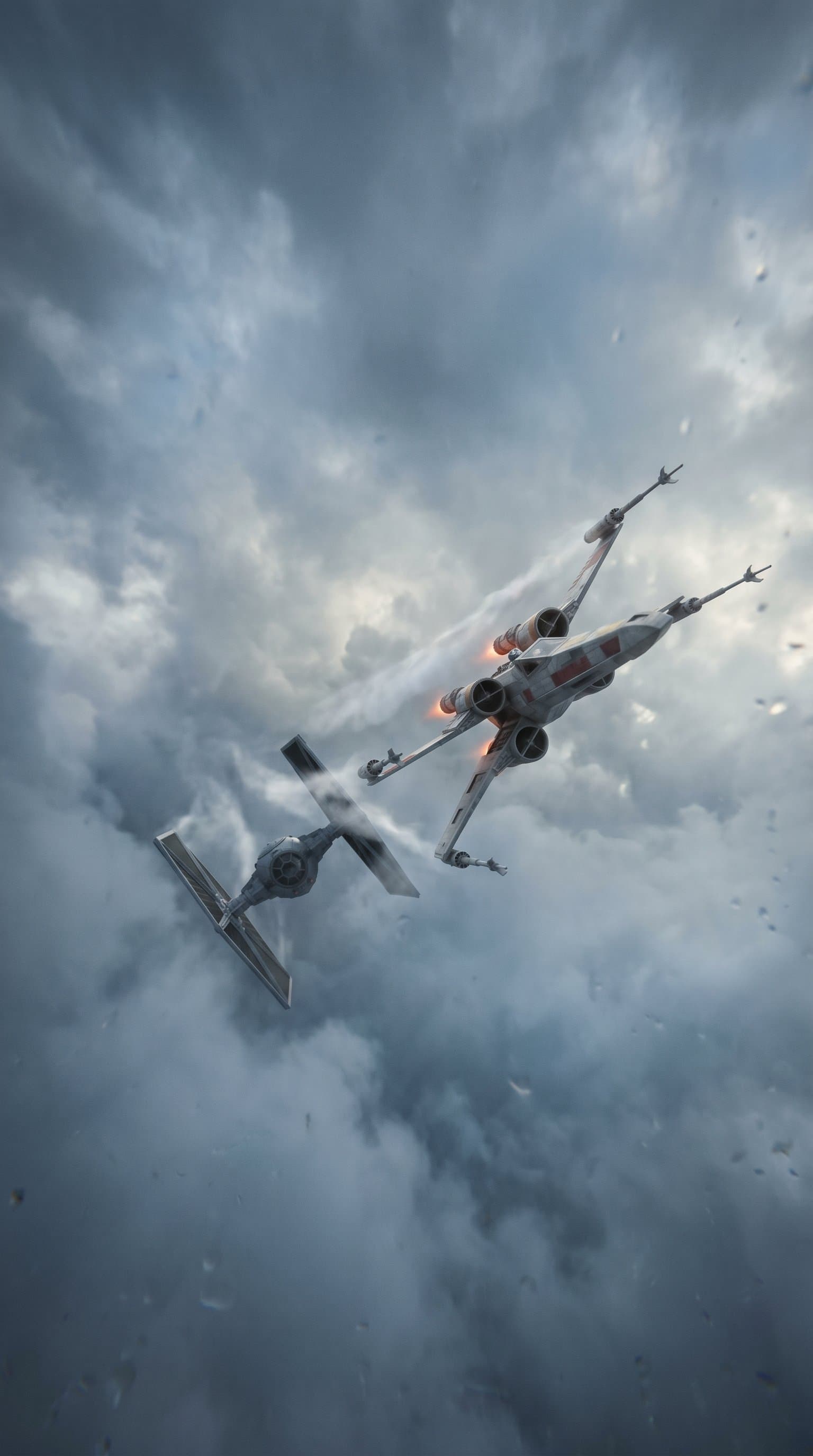 A TIE Fighter chasing an X-Wing in the midst of a cloud cover