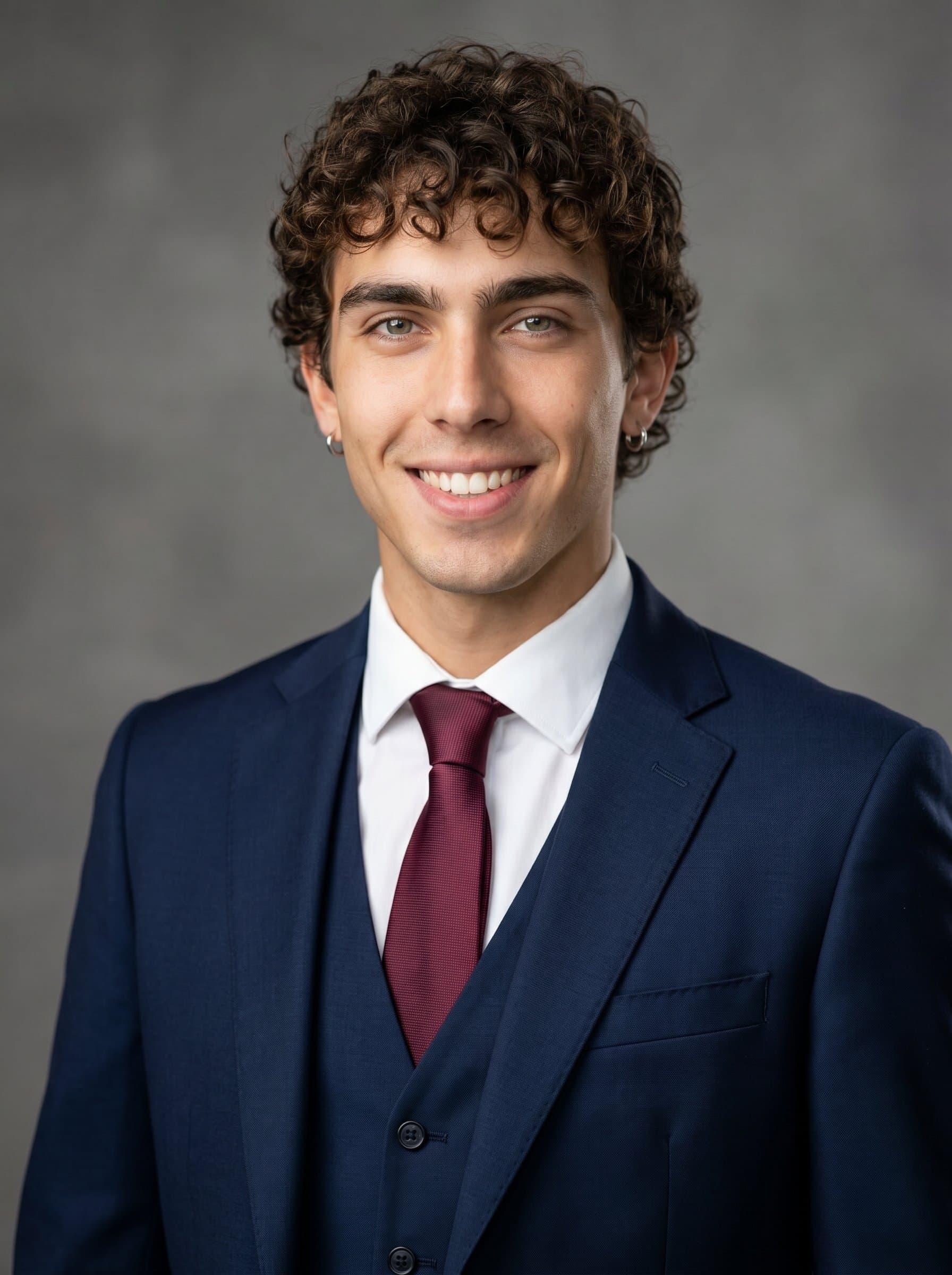 dressed in a smart suit, poses with a confident smile. Neutral background and strategic lighting for a professional headshot, emphasizing reliability and approachability for a news anchor role.