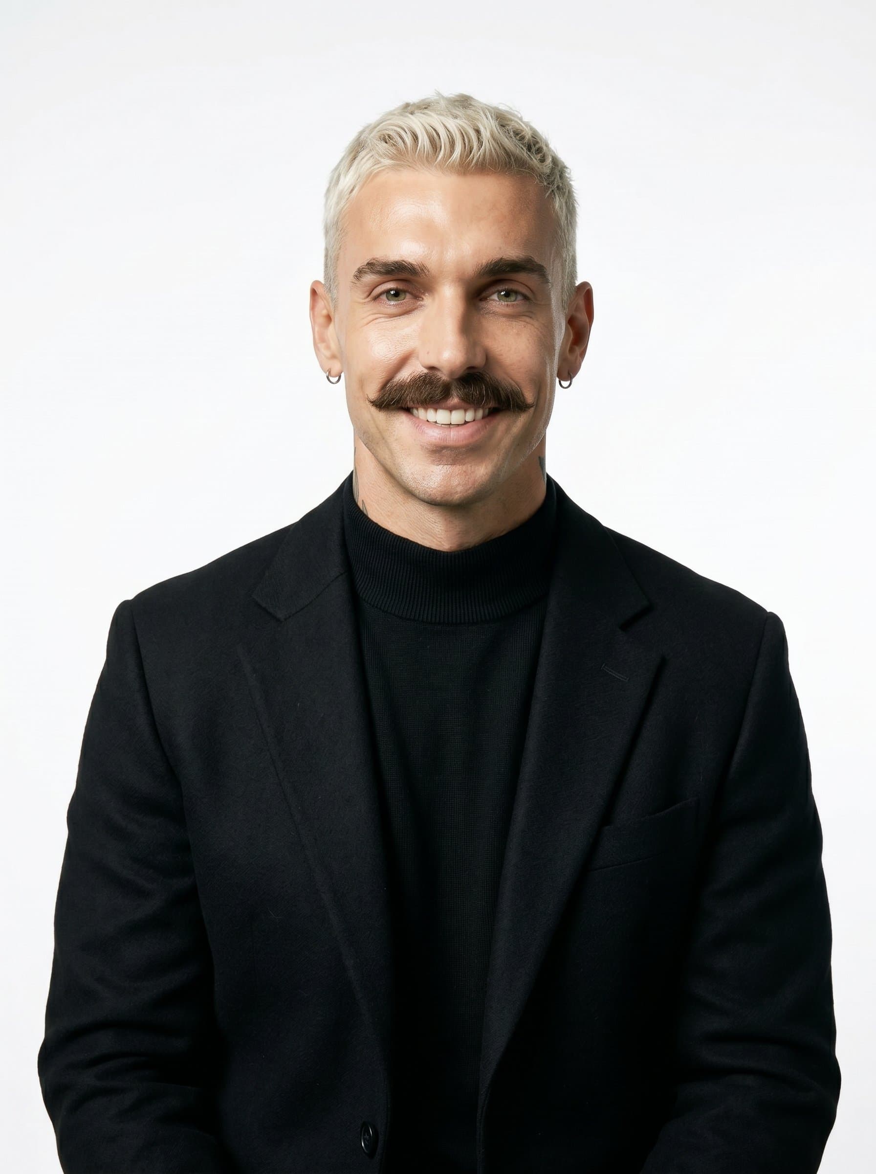 Fashion a headshot of a poised speaker wearing a classic black turtleneck and blazer. The simple white background ensures a focus on the man’s welcoming eyes and confident aura.