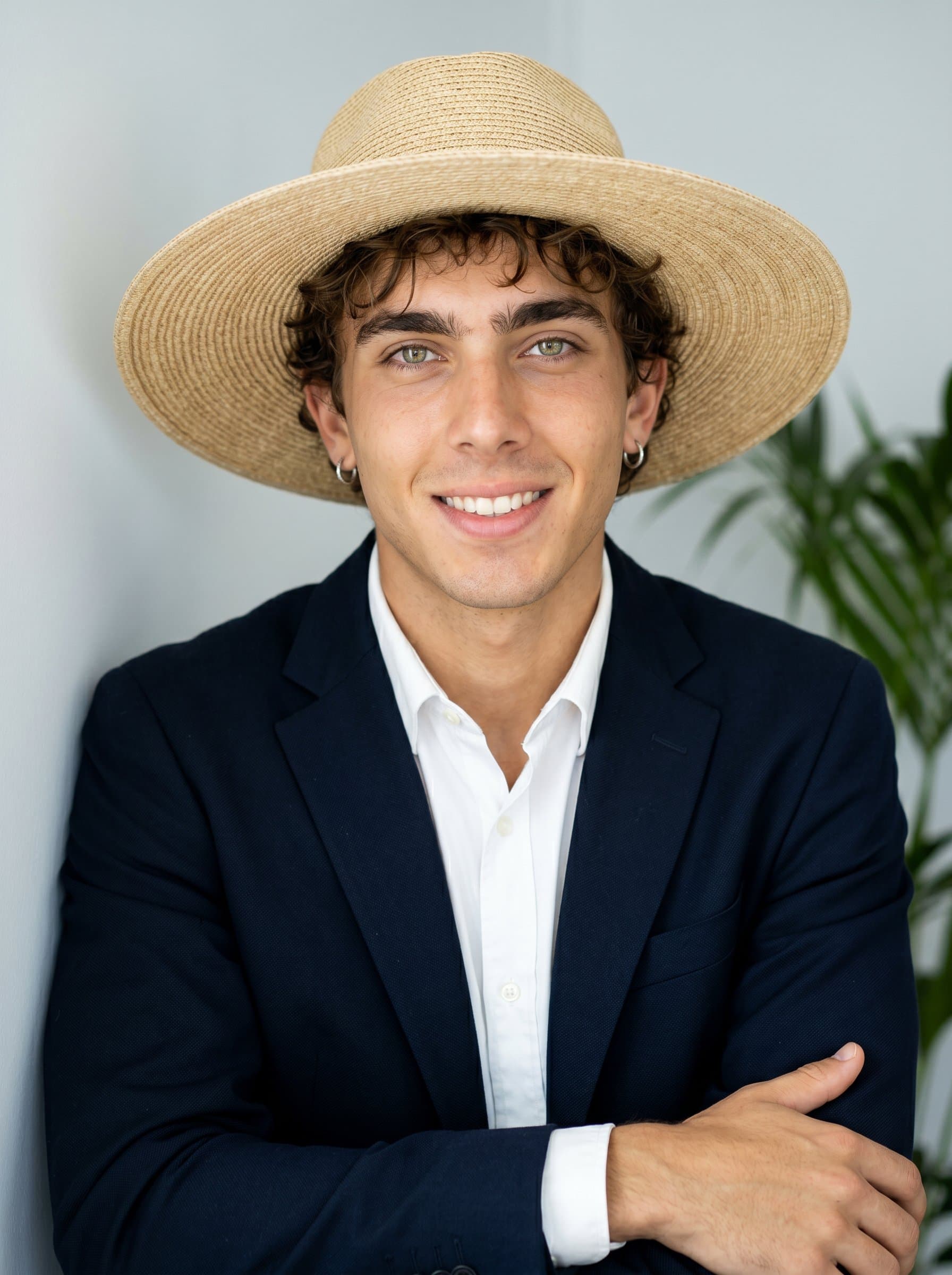Design a photo capturing a confident and relaxed demeanor, with natural lighting and a simple backdrop, aimed at recruiters who want to convey professionalism and ease simultaneously.