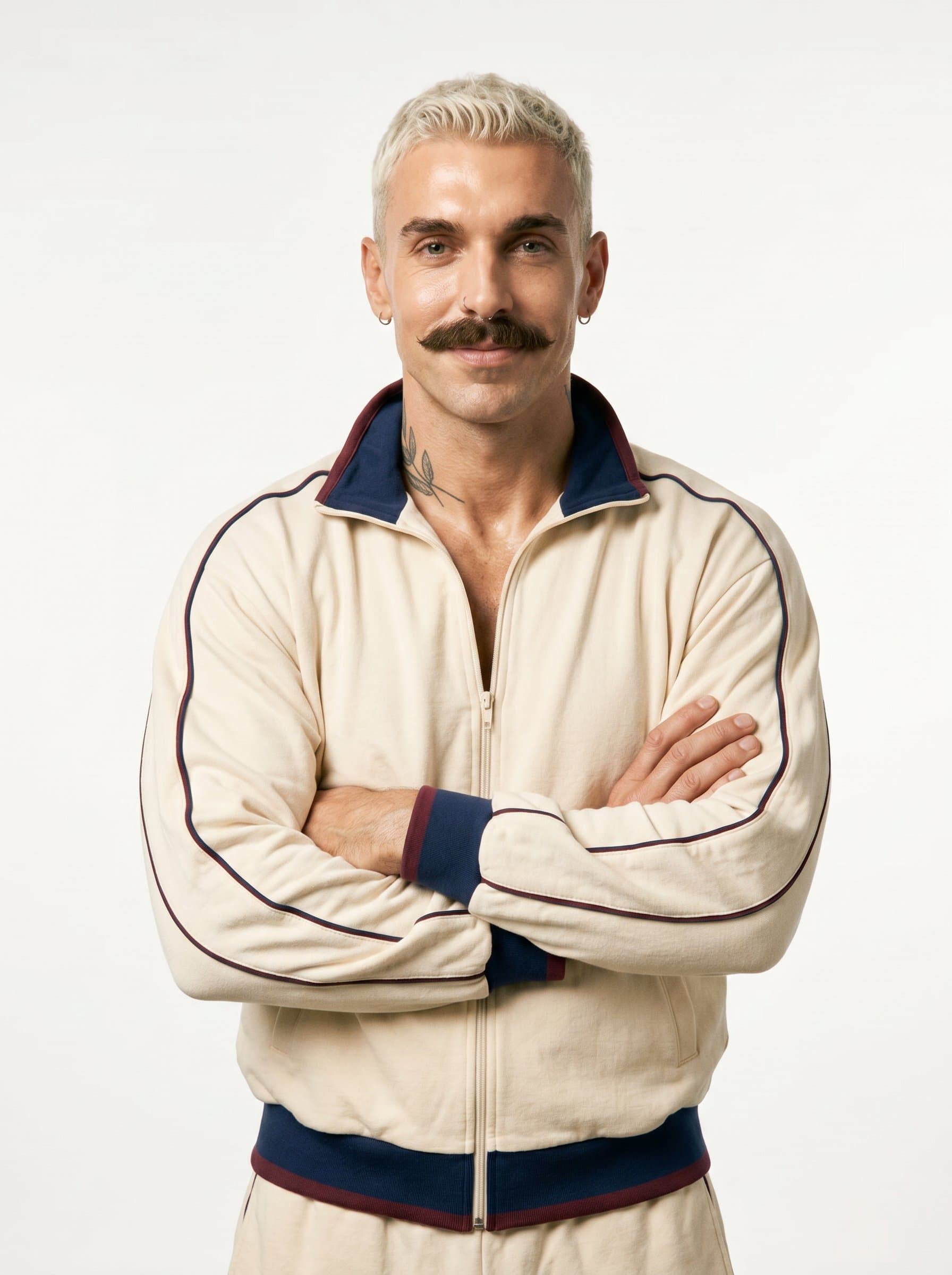 : A solopreneur displaying thoughtful composure, with a gentle smile and crossed arms. The clean white background and warm lighting create a picture of reliability and welcoming professional demeanor.