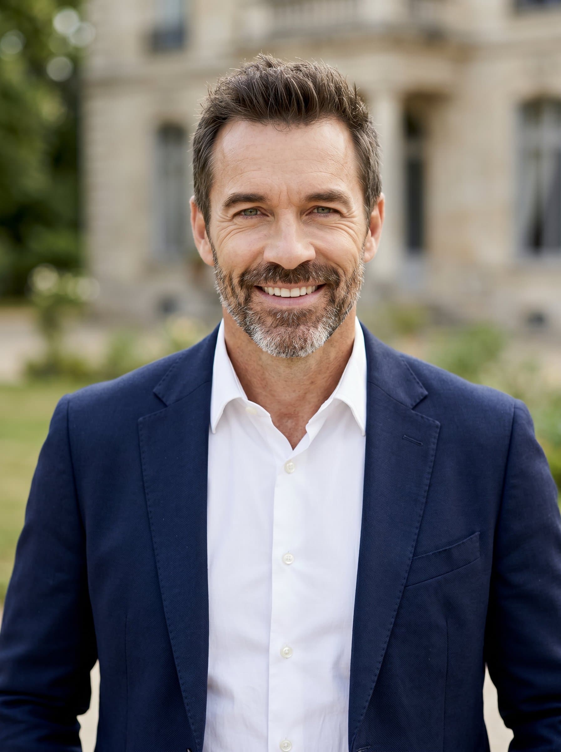 : Develop a headshot with strong eye contact and a genuine smile, utilizing natural light to enhance a sense of transparency, ideal for political brochures and flyers.