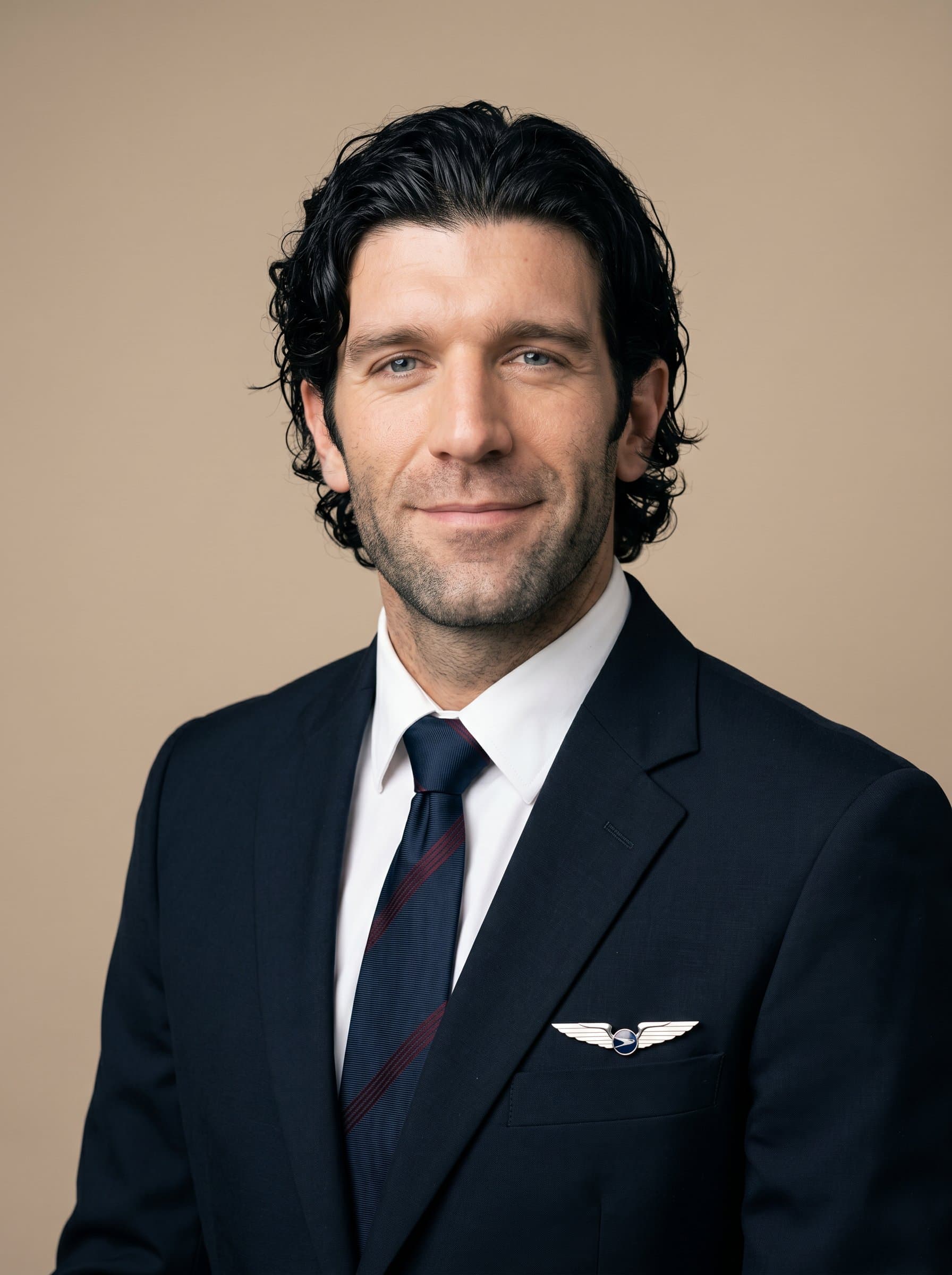 : Flight attendant in a classic uniform, gently smiling, set against a neutral beige backdrop, with soft lighting accentuating a professional and friendly appearance, ideal for promotional materials.