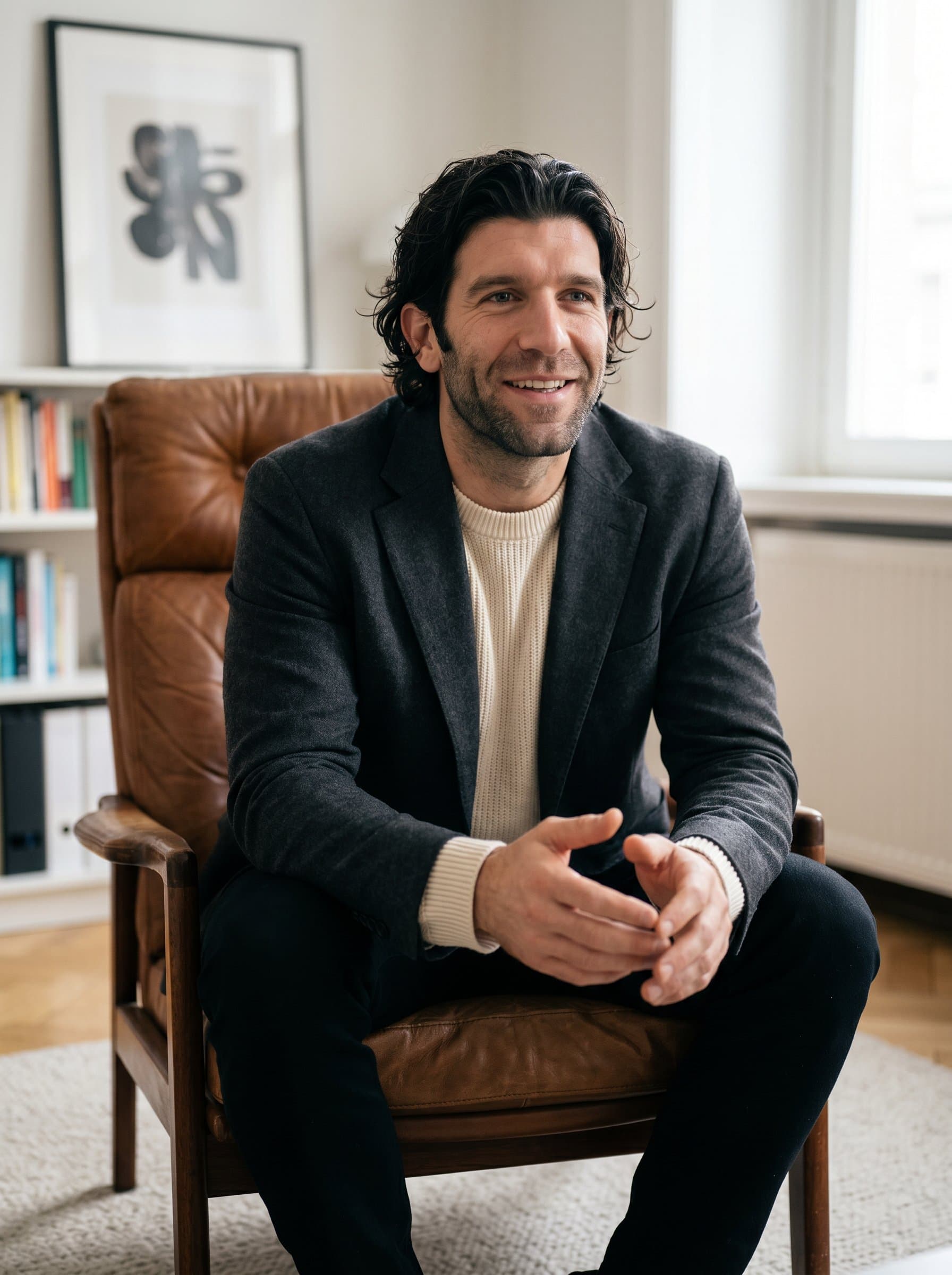 Elegant capturing a psychologist in a leather armchair, soft neutral colors around, their posture open and amiable, creating an image of confidence and sincere interest in their client’s story.