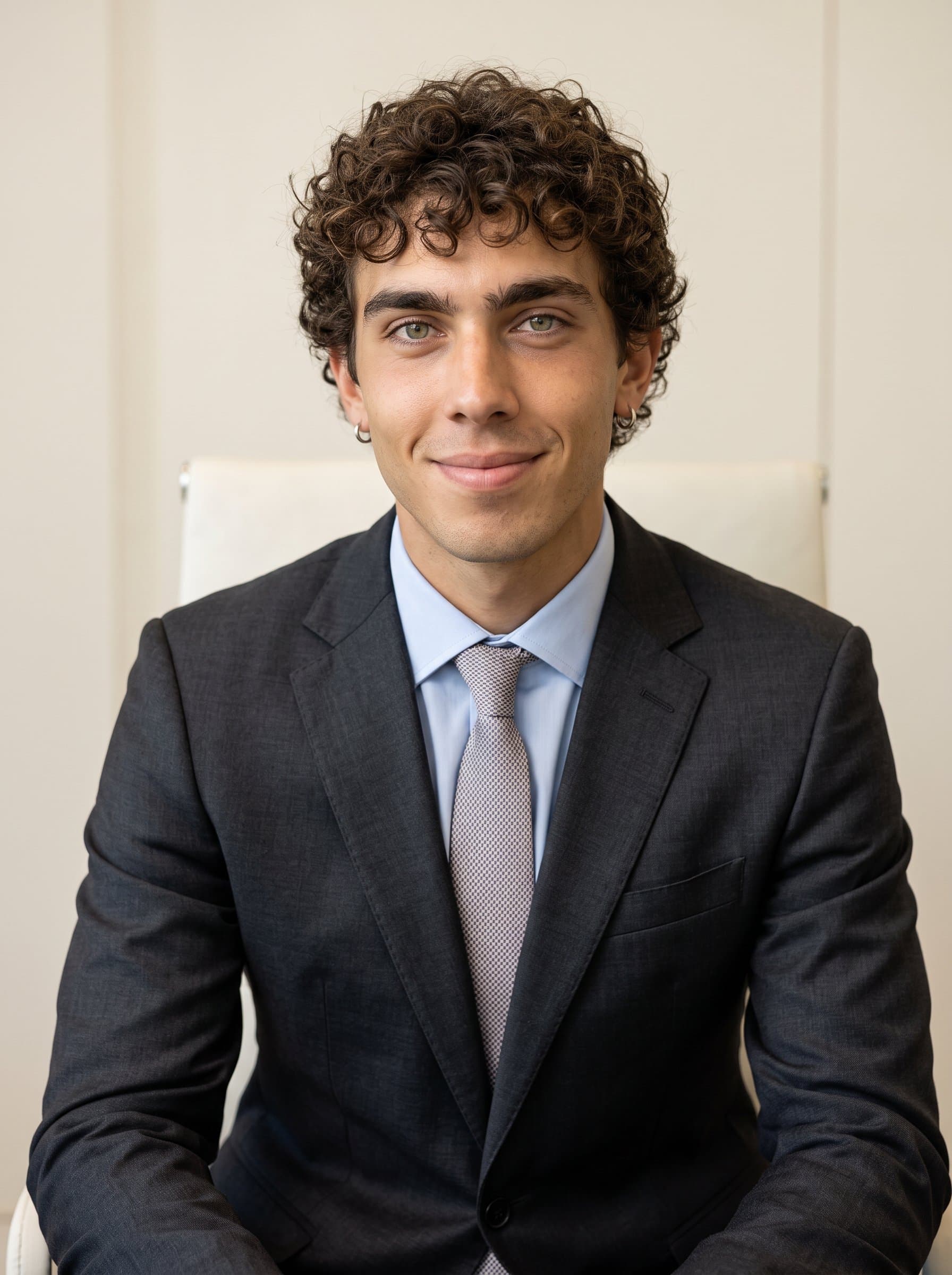 Photorealistic depicting a legal professional in a dark suit and pastel shirt, with a soft smile, against a neutral cream backdrop, suggesting approachability and competence.
