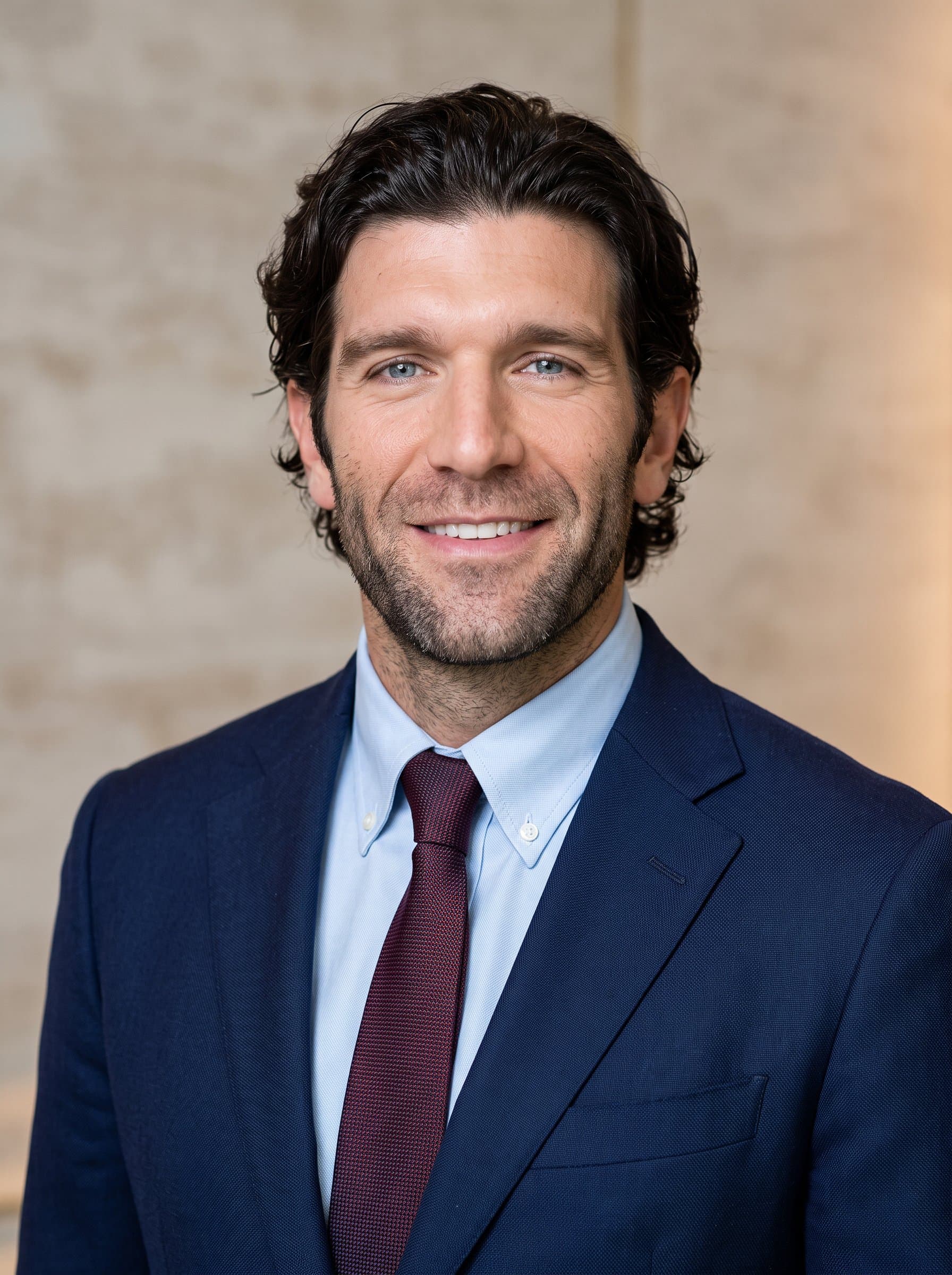 Photorealistic headshot in elegant business attire, showcasing a confident yet approachable expression. The warm lighting and neutral background enhance the diverse mix of ethnicities and genders within the hospitality industry.