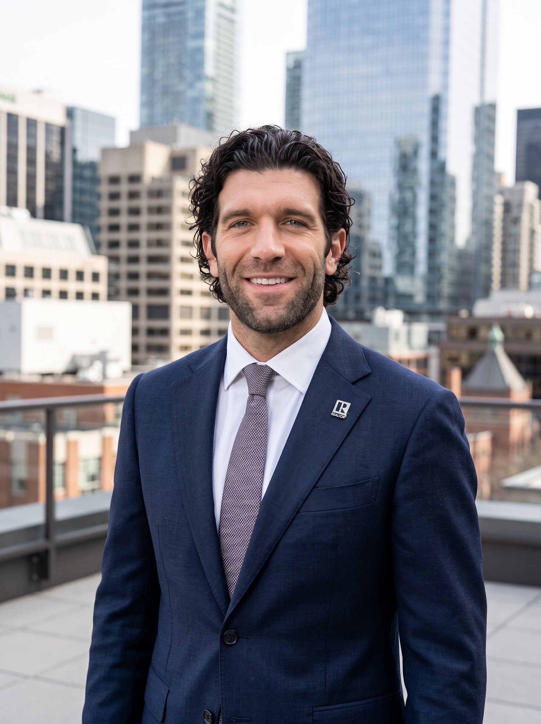 : Present a headshot of a real estate professional with city architecture in the background. Dressed in formal attire, the man projects a confident and friendly image, ideal for marketing use.