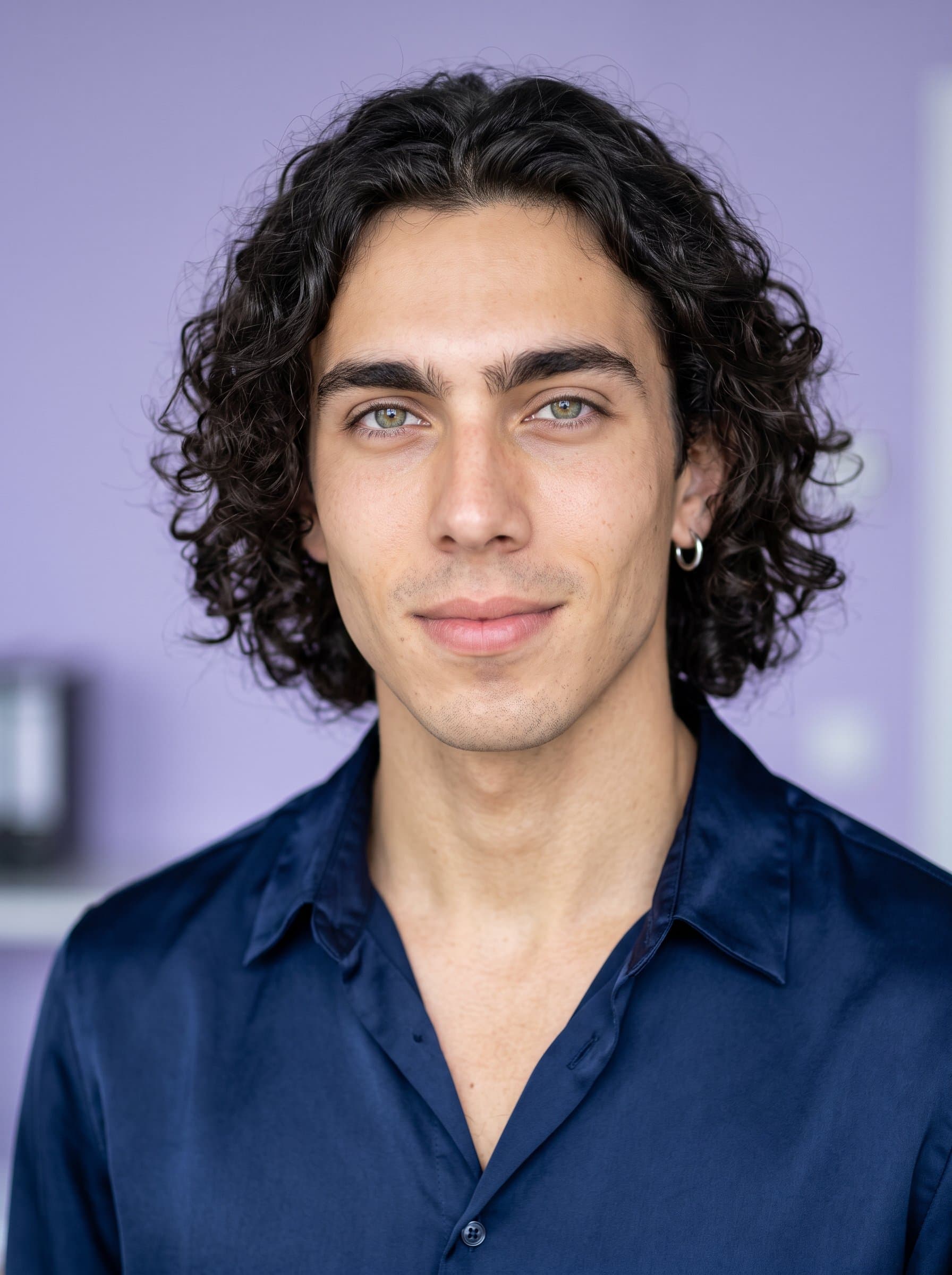 team player with shoulder-length curly hair, wearing a sophisticated blouse. Subtle lavender background, presenting a calm and collected demeanor with a focus on clarity and engagement.