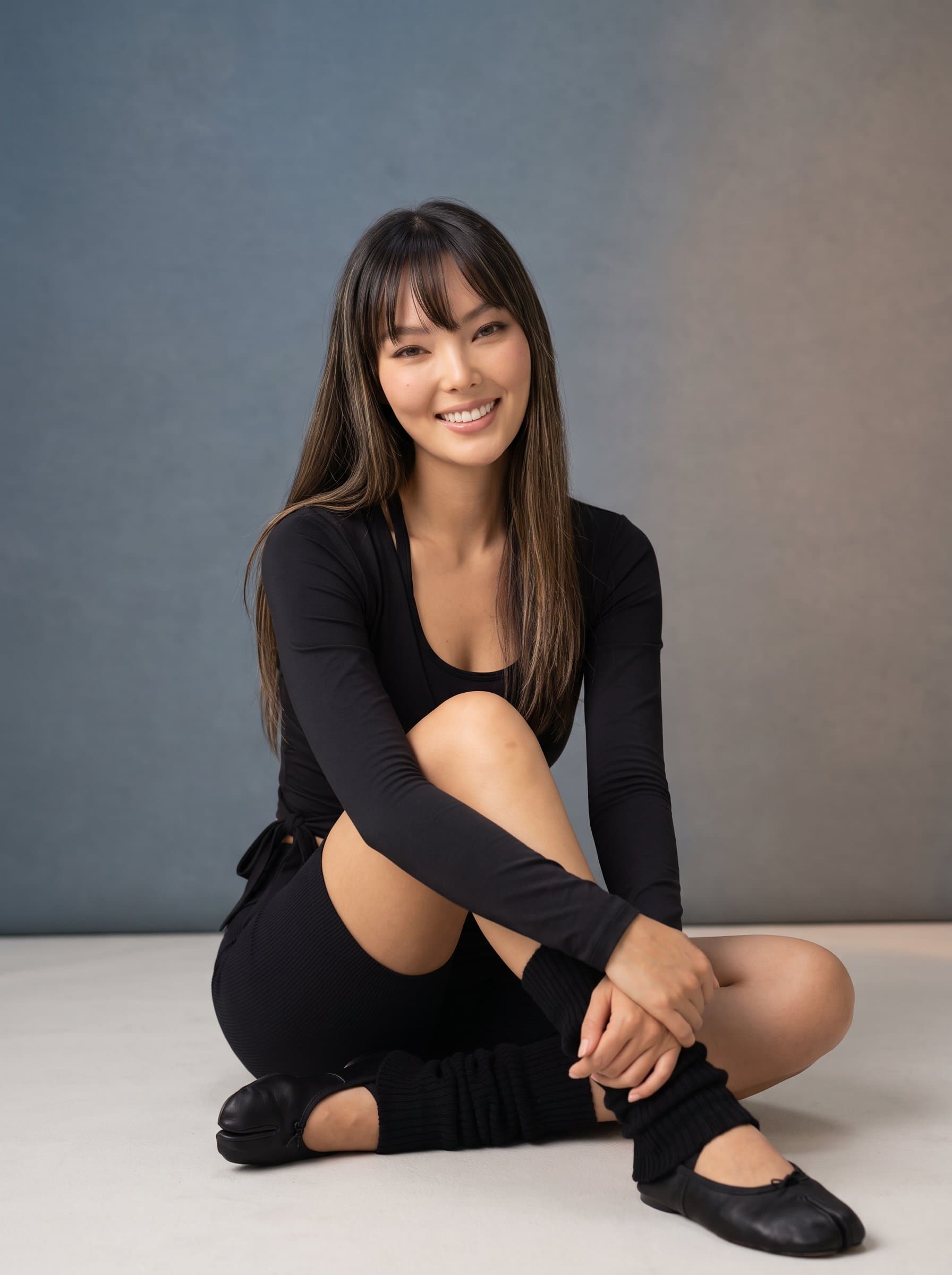 smiling warmly in a professional studio, wearing athleisure, with a backdrop of subtle gradients to enhance approachability while maintaining an aura of expertise and readiness to inspire.