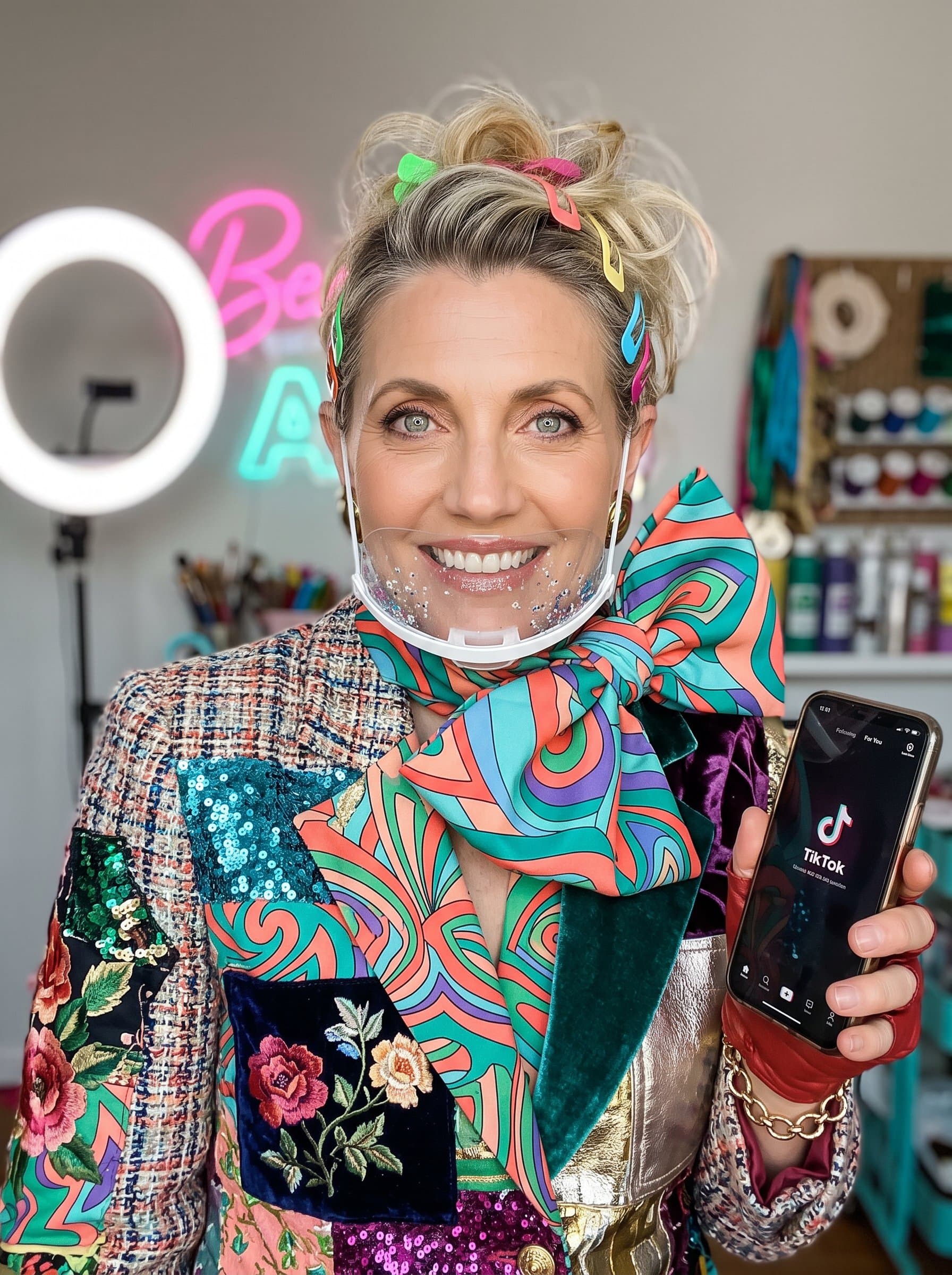headshot capturing a woman in a surreal, mixed-material outfit, with bold patterns and vivid colors, representing their creative and eclectic style as a TikTok content creator.