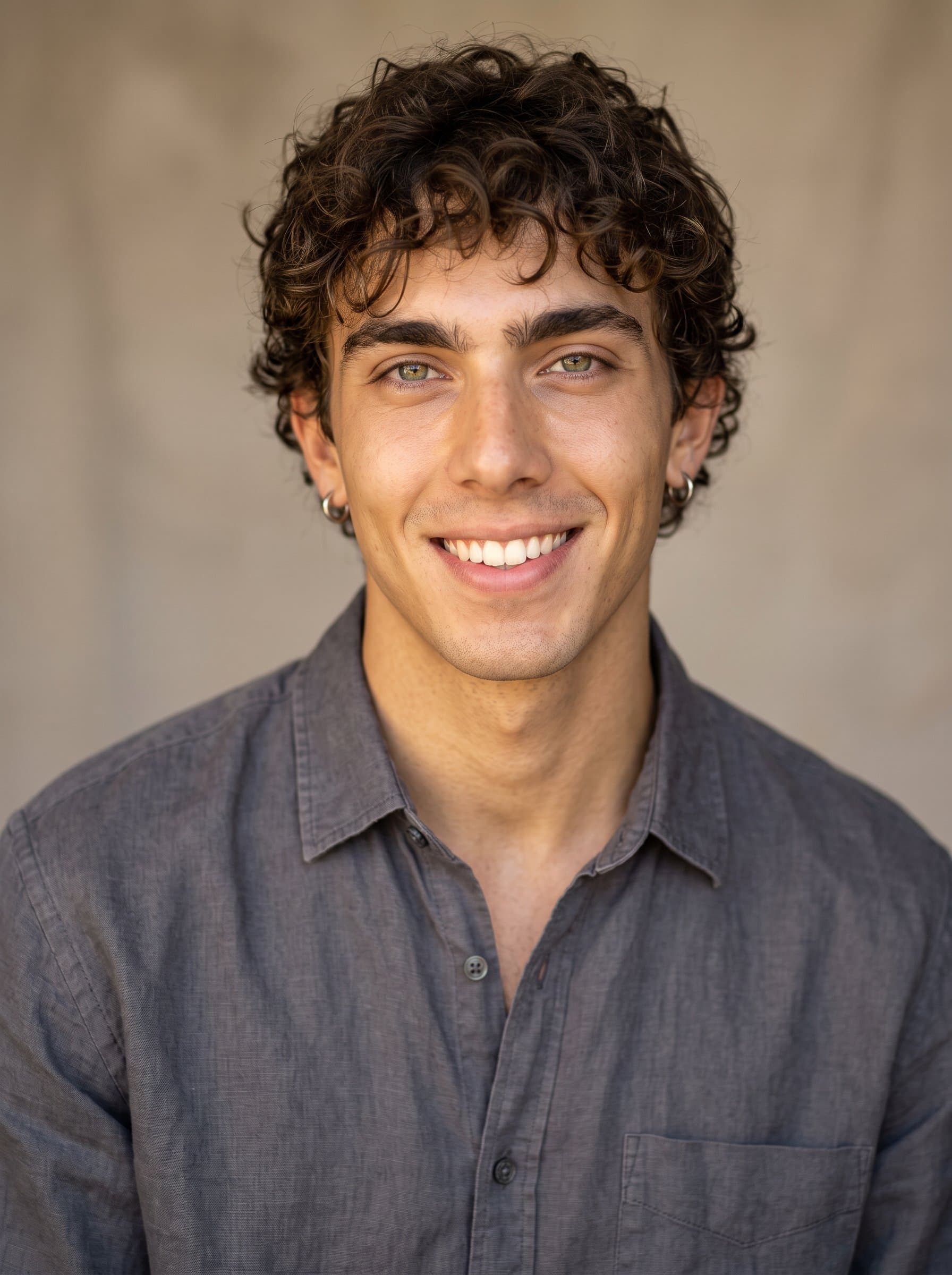 Generate an image of in a headshot, wearing a contemporary shirt with a relaxed fit, exuding a warm, professional vibe, against a neutral background softly lit to enhance the overall appearance.