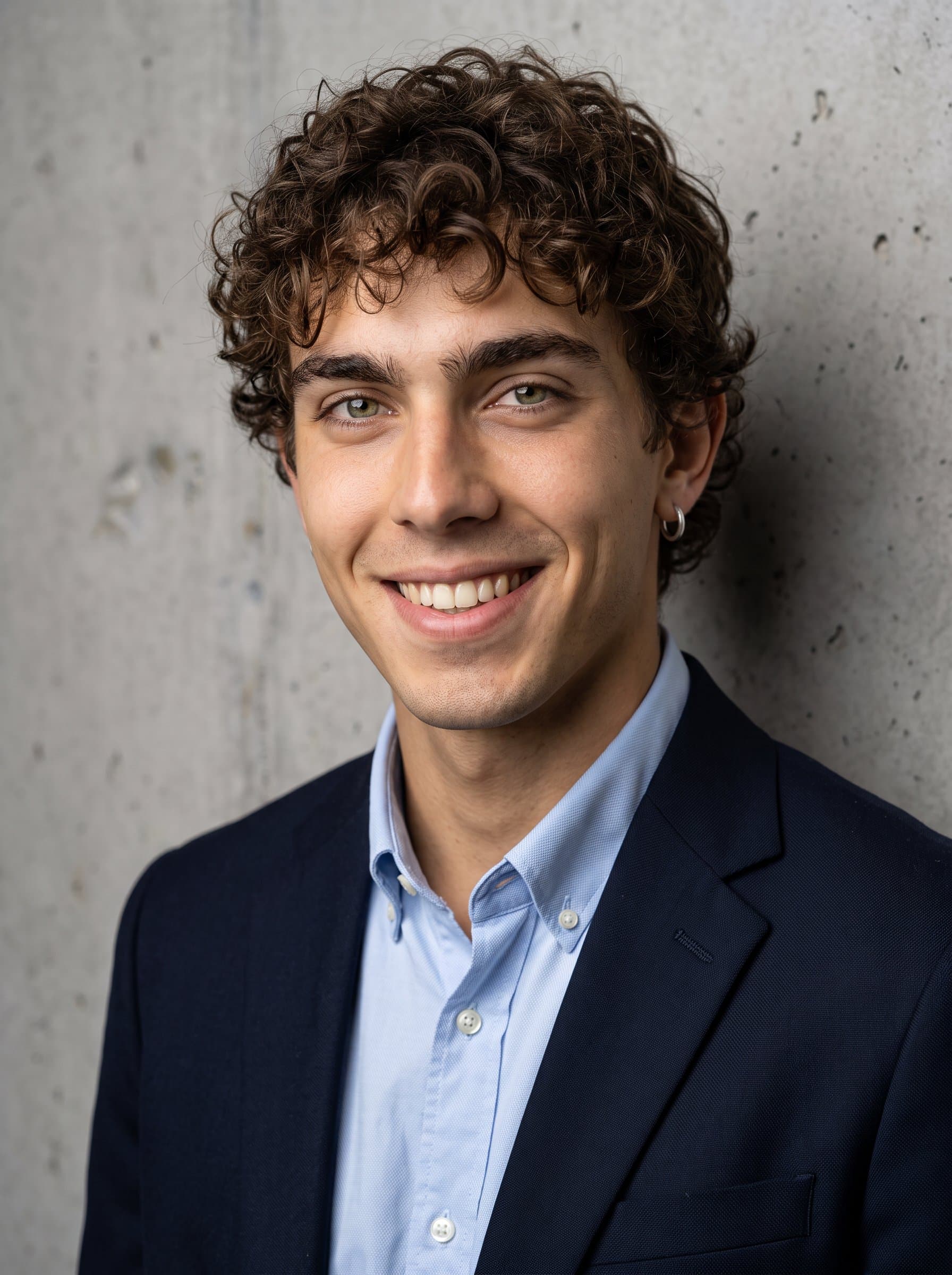 Create a against a textured wall backdrop. The man's attire is business casual, with a relaxed smile that conveys openness and approachability, ideal for customer-facing roles.