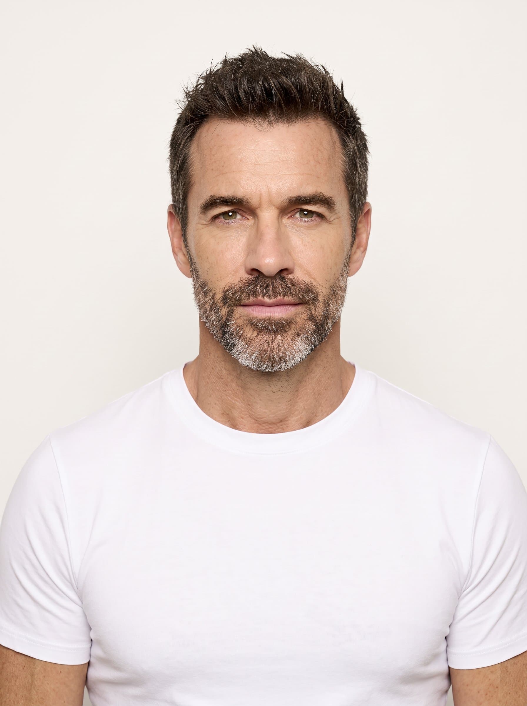 Generate a passport photo with a clean, simple background and evenly distributed lighting. Focus on a centered, photorealistic face with a neutral expression, adhering to official guidelines.