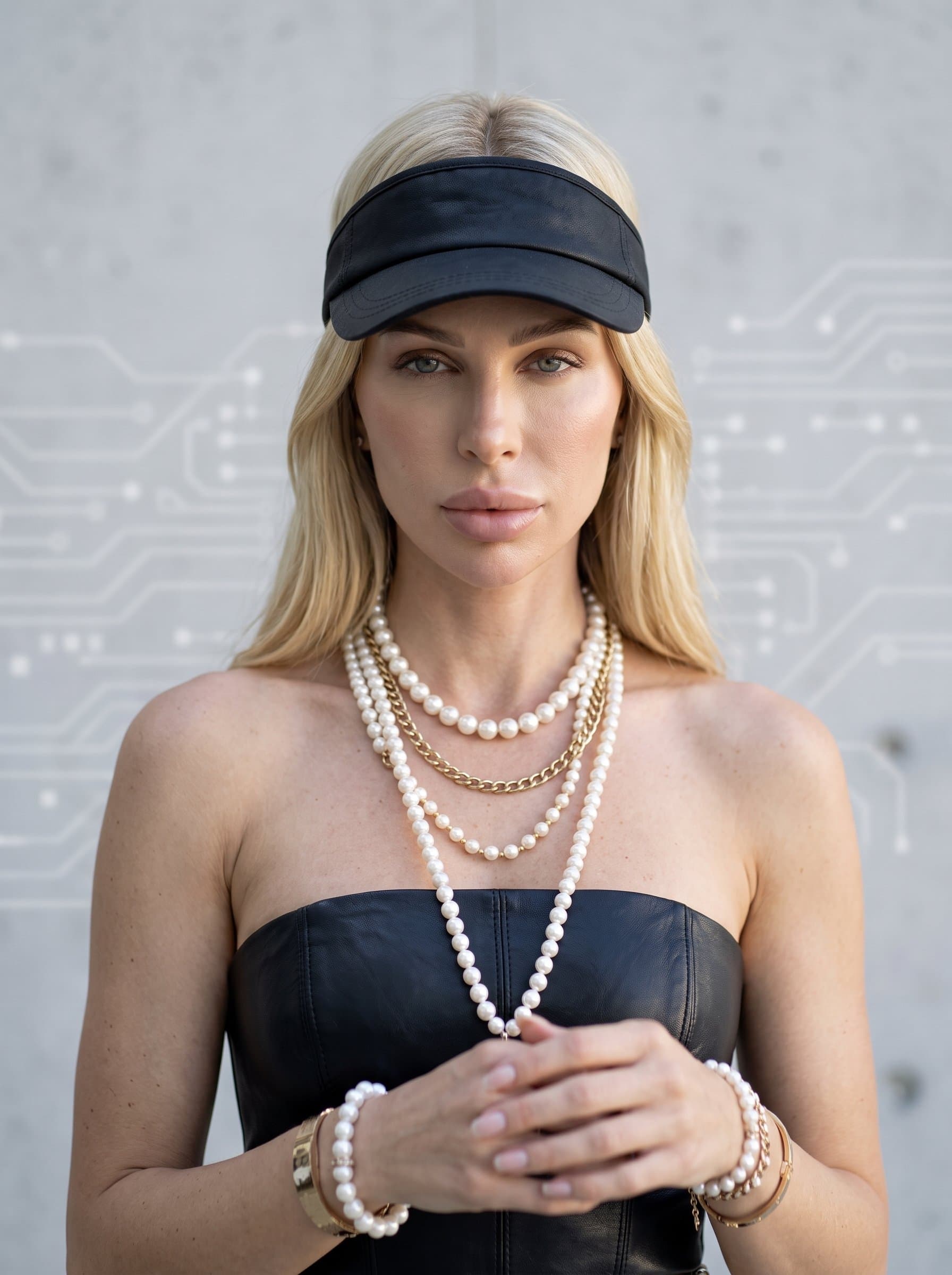 : Design an AI-generated headshot with a tech-centric vibe. The woman should be gender-neutral, posed in a minimalist setting with natural light highlighting facial features against a simple backdrop.